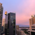 pink sunset clouds through tall buildings in Sydney CBD