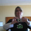 Deirdré in a hotel room, wearing the Joyent DTrace t-shirt