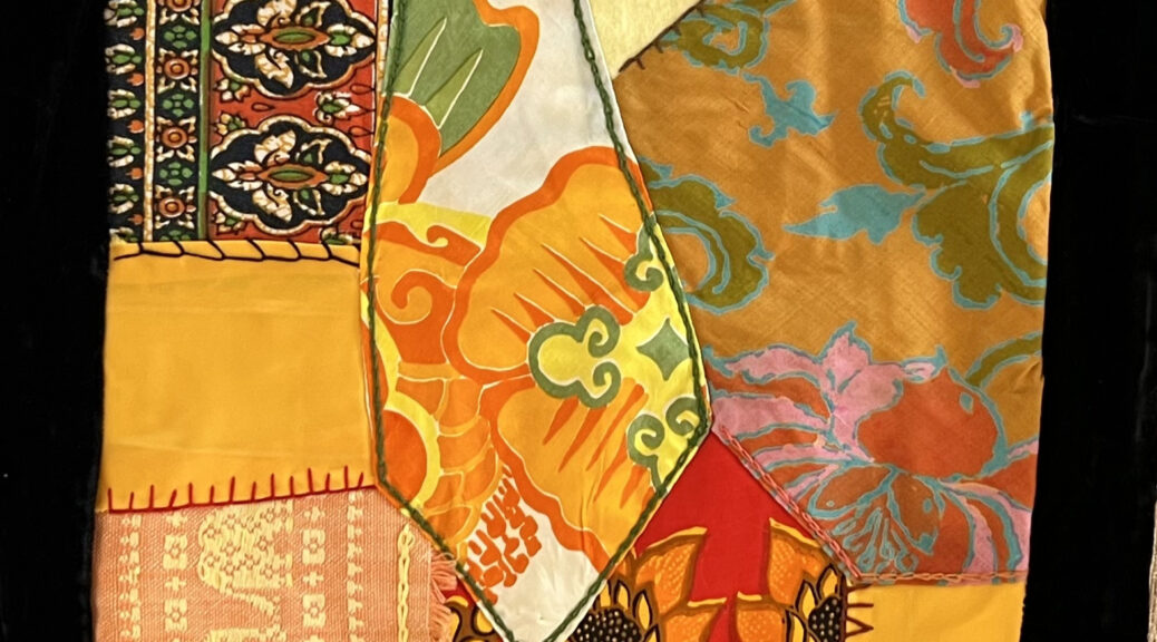 quilt block in yellows and oranges, mostly silk and cotton fabrics from Thailand