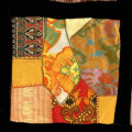 quilt block in yellows and oranges, mostly silk and cotton fabrics from Thailand